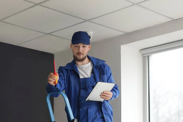 Worker Installing Alarm System Indoors — Stock Photo, Image