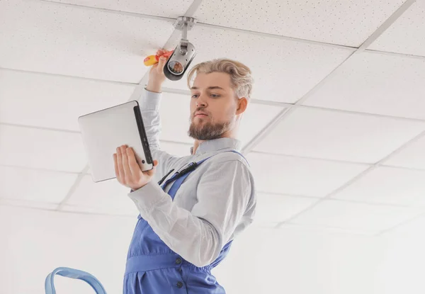 Worker Installing Alarm System Indoors — Stock Photo, Image