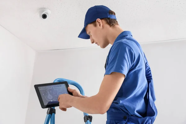 Worker Installing Alarm System Indoors — Stock Photo, Image