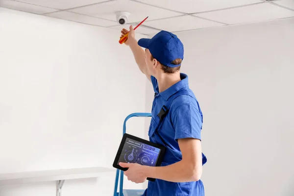 Worker Installing Alarm System Indoors — Stock Photo, Image