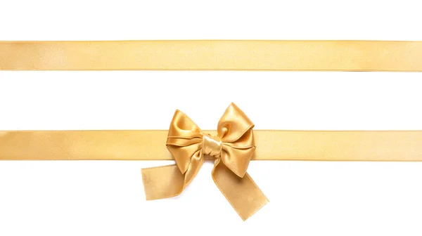 Fitas Douradas Bonitas Com Arco Fundo Branco — Fotografia de Stock