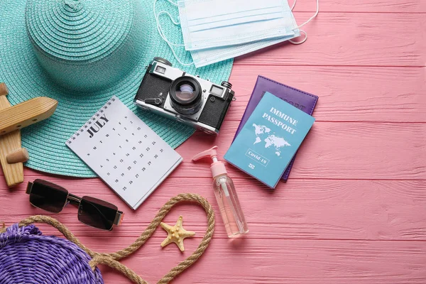 Calendar Beach Accessories Medical Masks Immune Passport Color Wooden Background — Stock Photo, Image