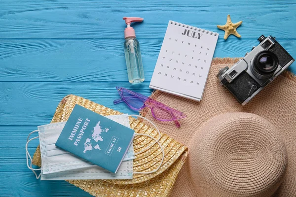 Calendar Beach Accessories Medical Masks Immune Passport Color Wooden Background — Stock Photo, Image