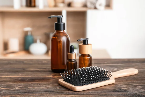 Hair Brush Bottles Cosmetic Products Wooden Table Room — Stock Photo, Image