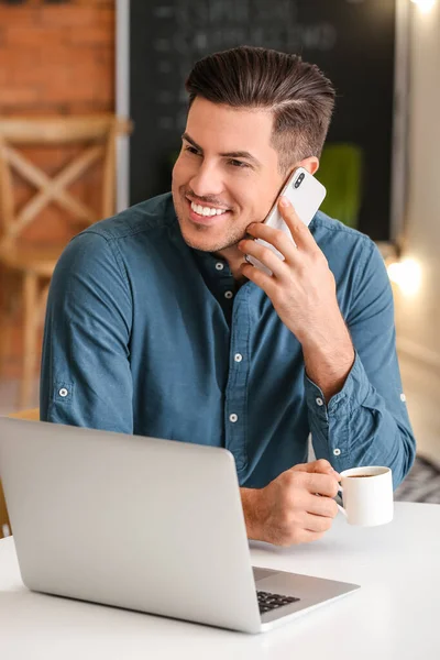 Handsome Young Man Drinking Coffee While Talking Mobile Phone Cafe — Stock Photo, Image