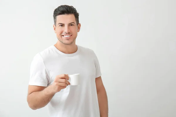 Handsome Young Man Drinking Coffee Light Background — Stock Photo, Image