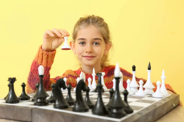 Cute Little Girl Playing Chess Color Background — Stock Photo, Image