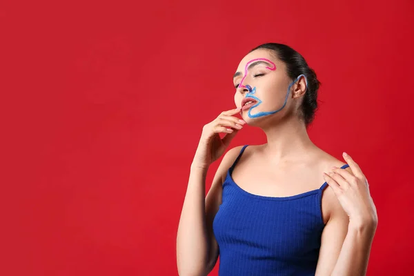 Beautiful Young Woman Paint Her Face Color Background — Stock Photo, Image