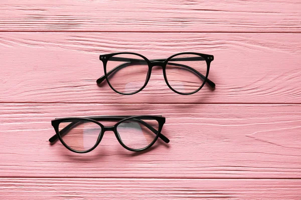 Different Stylish Eyeglasses Color Wooden Background — Stock Photo, Image