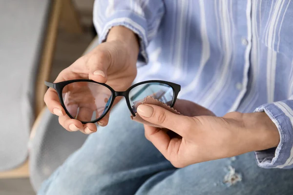 Woman Wiping Stylish Eyeglasses Home Closeup — Stock Photo, Image