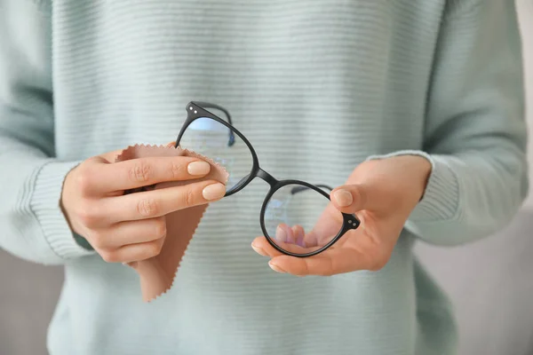 Woman Wiping Stylish Eyeglasses Closeup — Stock Photo, Image