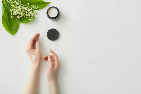 Woman Applying Hand Cream Light Background — Stock Photo, Image