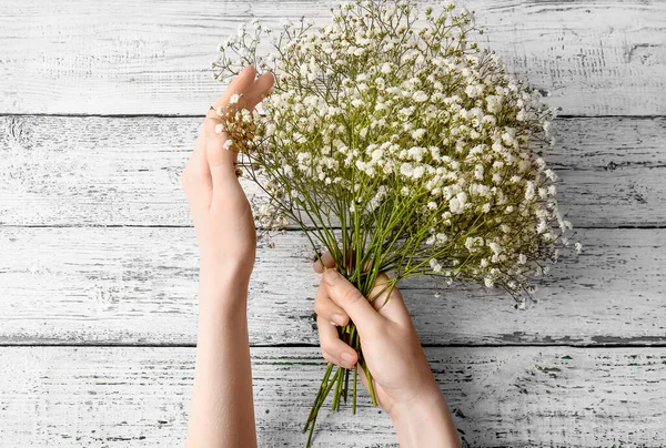 Female Hands Beautiful Gypsophila Flowers Light Wooden Background — Stock Photo, Image