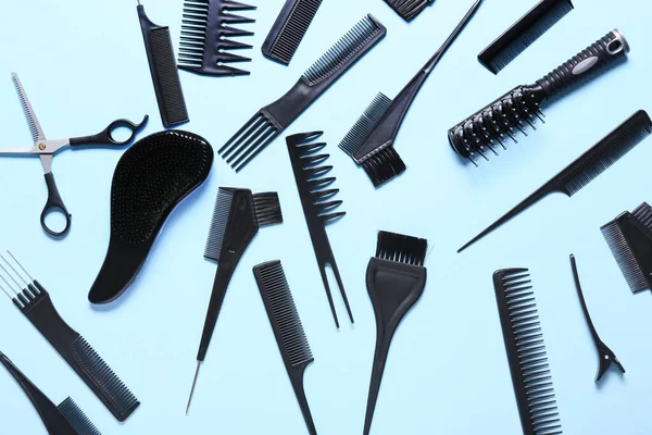 Set of hairdresser\'s tools on color background