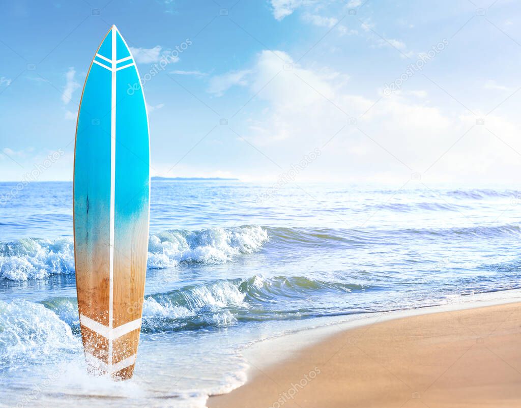Wooden surfboard on sea beach