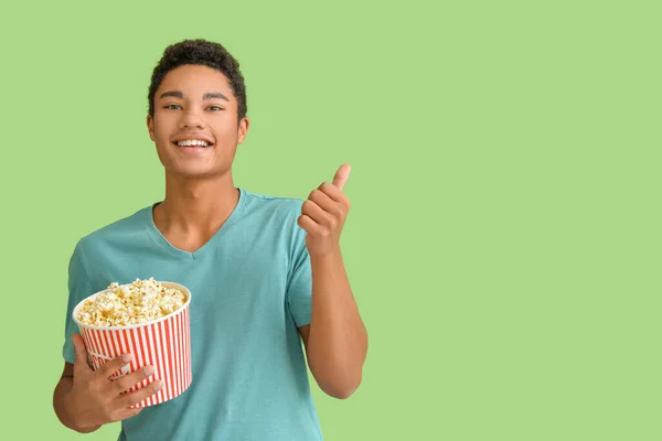 Emotional African American Teenager Popcorn Showing Thumb Color Background — Stock Photo, Image