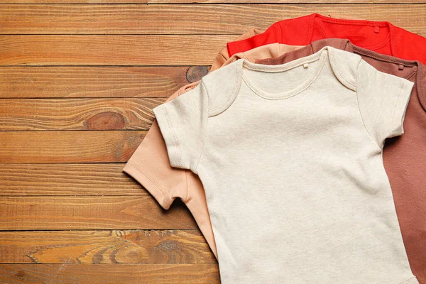 Baby Clothes Wooden Background — Stock Photo, Image