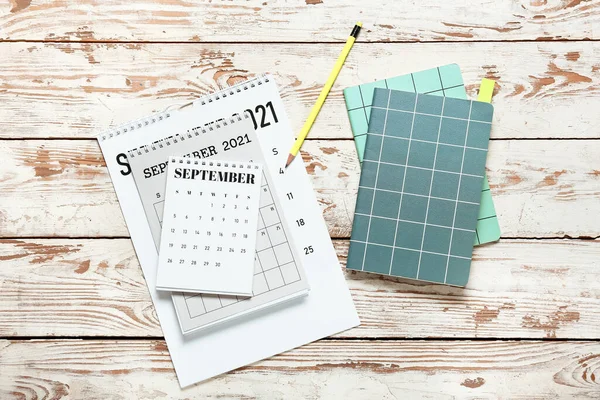 Flip Paper Calendars Notebooks Pencil Light Wooden Background — Stock Photo, Image