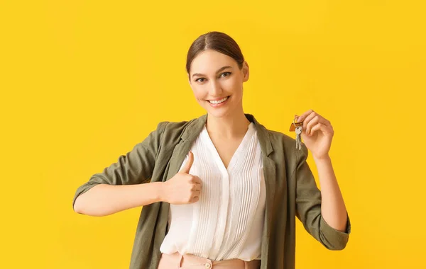 Happy Young Woman Key House Showing Thumb Color Background — Stock Photo, Image