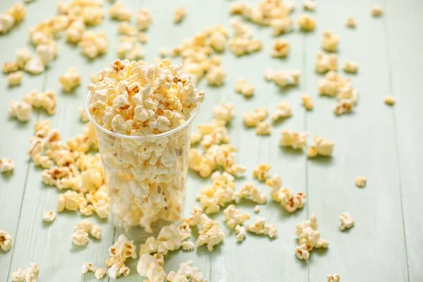 Cup Tasty Popcorn Color Wooden Background — Stock Photo, Image