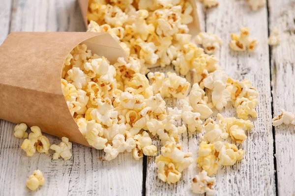 Paper Bags Tasty Popcorn Light Wooden Background — Stock Photo, Image