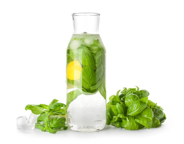 Бутылка лимонада с базиликом на белом фоне