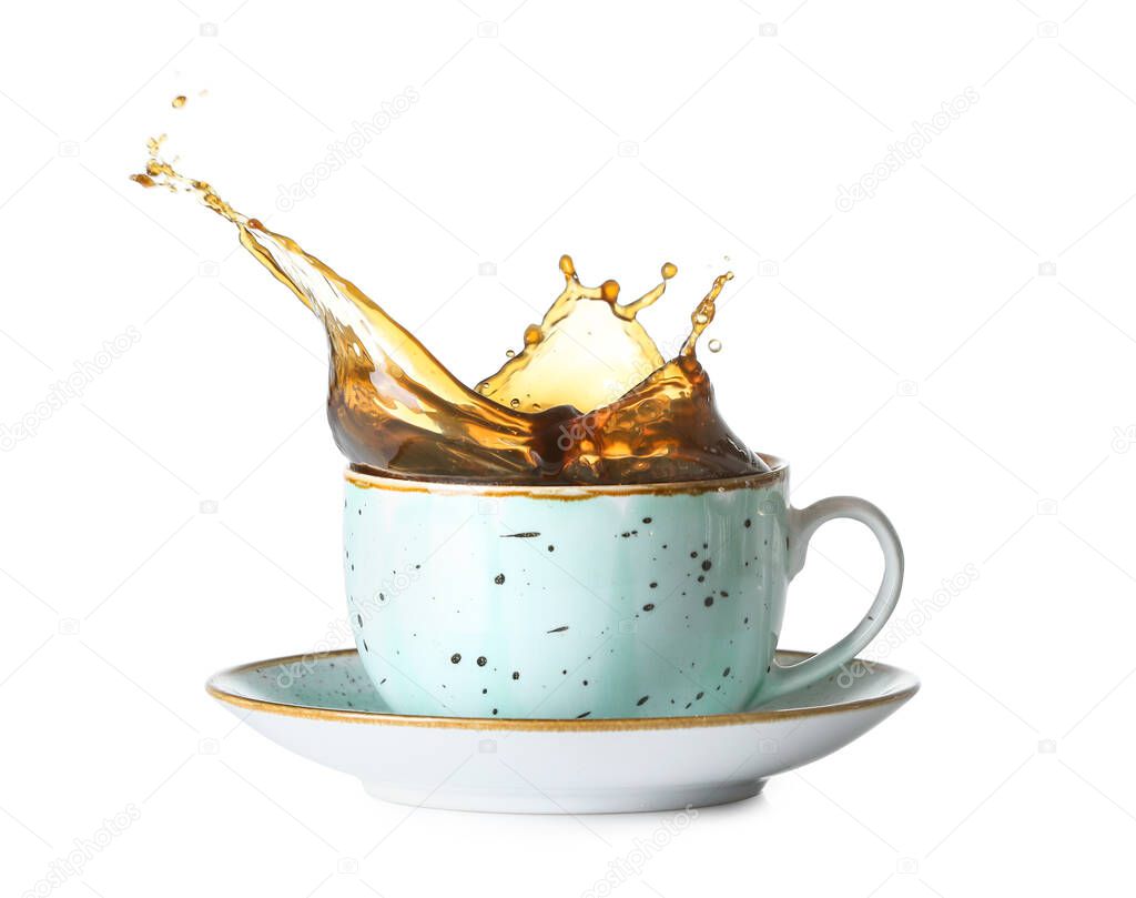 Splash of coffee in cup on white background