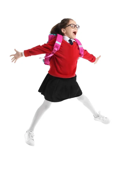 Springen Kleines Schulmädchen Auf Weißem Hintergrund — Stockfoto