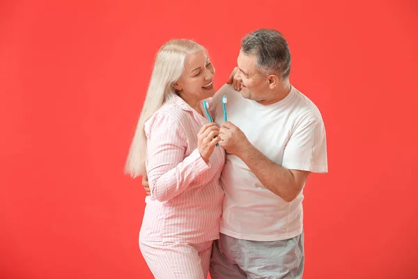Mature Couple Brushing Teeth Color Background — Stock Photo, Image