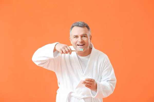 Mature Man Brushing Teeth Color Background — Stock Photo, Image