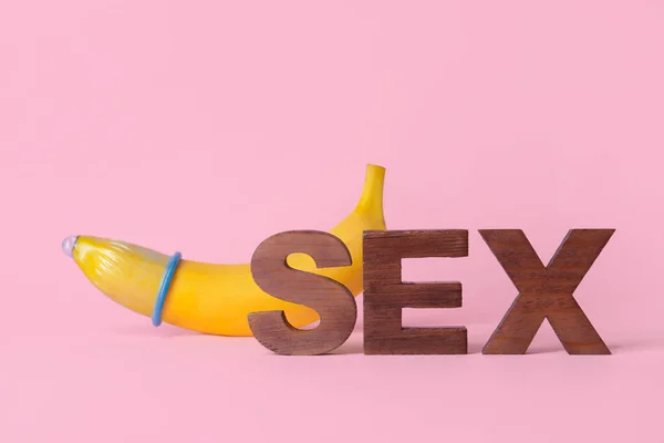 Word Sex Banana Condom Color Background — Stock Photo, Image