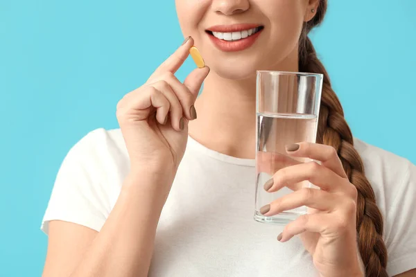 Young Woman Taking Fish Oil Color Background Closeup — Stock Photo, Image