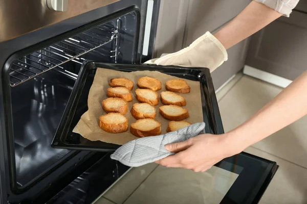 Woman Taking Baking Sheet Toasted Bread Out Oven Closeup — Stock Photo, Image