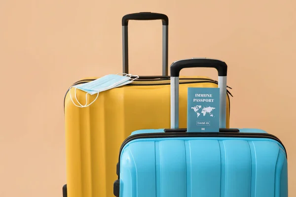 Packed Suitcases Immune Passport Medical Masks Color Background — 图库照片