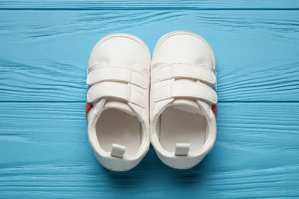 Stylish Baby Shoes Color Wooden Background — Stock Photo, Image