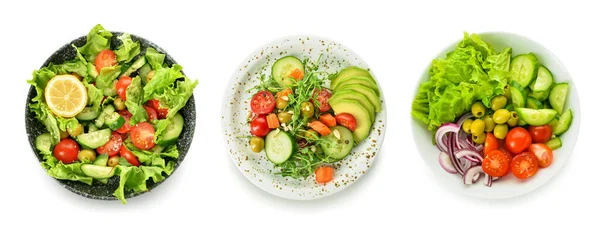 Placas Com Diferentes Saladas Saudáveis Fundo Branco — Fotografia de Stock