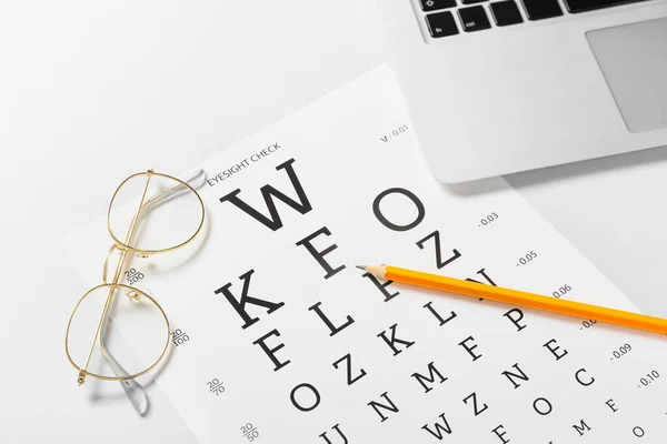 Composition Eyeglasses Eye Test Chart Light Background — Stock Photo, Image