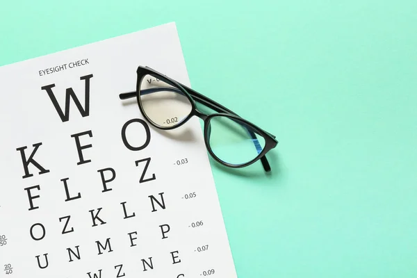 Stylish Eyeglasses Eye Test Chart Color Background — Stock Photo, Image