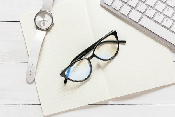 Composition Eyeglasses Notebook White Wooden Background — Stock Photo, Image