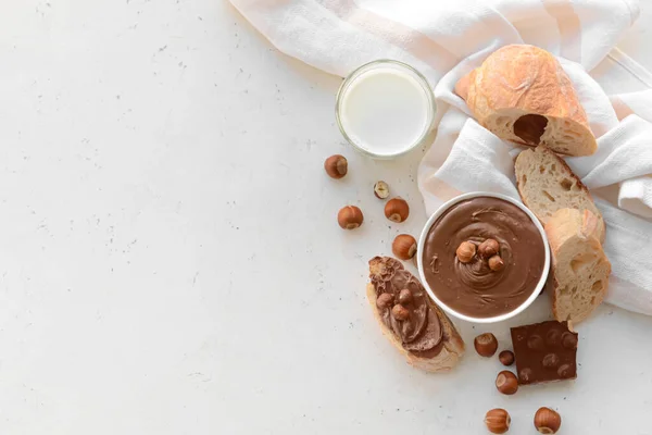 Bowl Tasty Chocolate Paste Hazelnuts Light Background — Stock Photo, Image