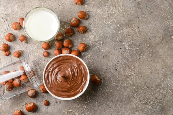 Bowl Tasty Chocolate Paste Hazelnuts Grey Background — Stock Photo, Image