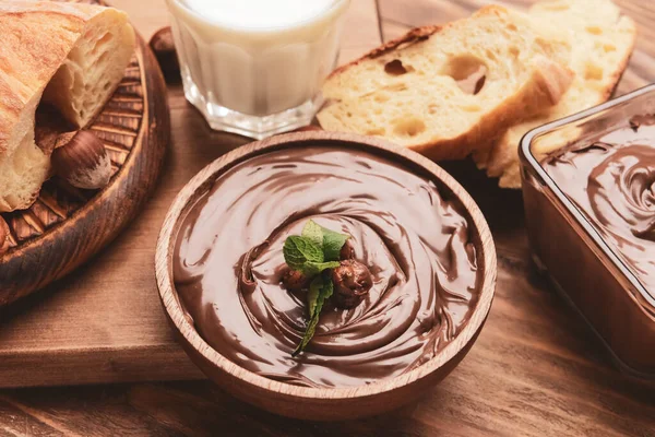 Bowl Tasty Chocolate Paste Hazelnuts Wooden Background — Stock Photo, Image