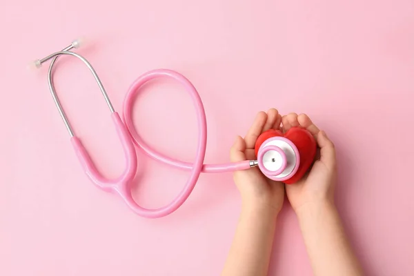 Child Hands Red Heart Stethoscope Color Background — Stock Photo, Image