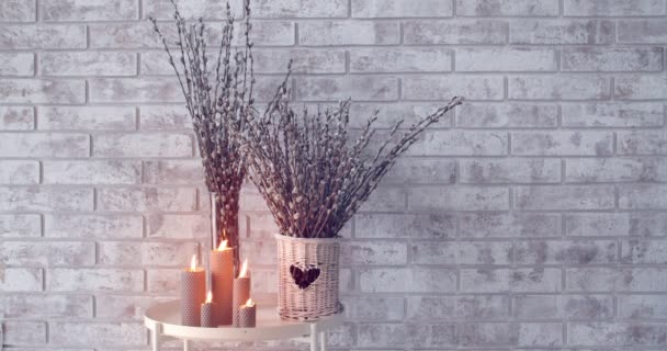 Pussy Willow Branches Burning Candles Table Brick Wall — Stok video