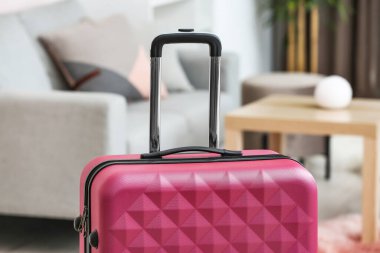 Packed suitcase in living room