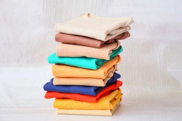 Stack Baby Clothes Light Background — Stock Photo, Image