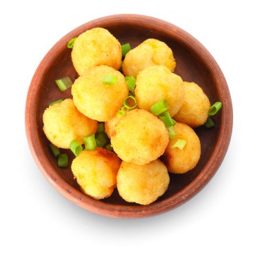 Bowl with fried potato balls on white background