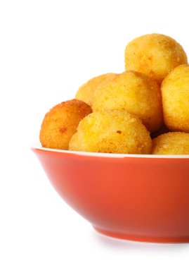 Bowl with fried potato balls on white background