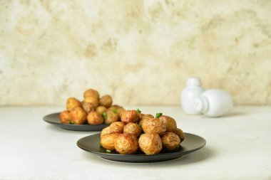Plates with tasty baked potato on table