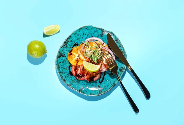 Plate Tasty Tomato Carpaccio Lime Cutlery Color Background — Φωτογραφία Αρχείου